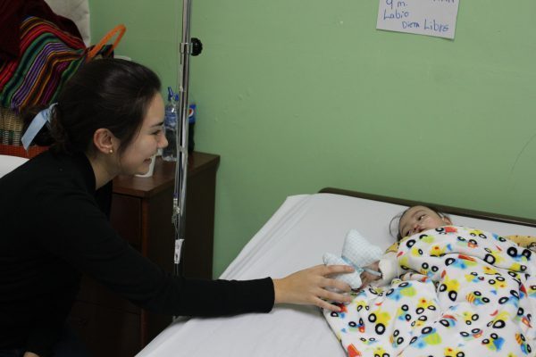 Alé van Scoyoc visits nine-month-old patient post-surgery.